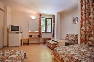 TV a/nebo společenská místnost v ubytování Hotel Sigma