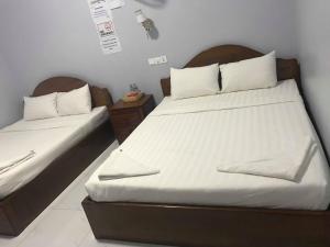 Ein Bett oder Betten in einem Zimmer der Unterkunft KampongBay Makeng II Guesthouse