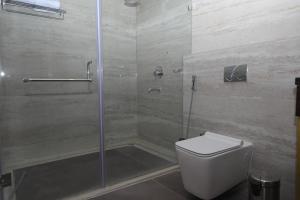 Koupelna v ubytování Visthara inn - Comfort Stay