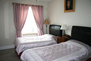 Postel nebo postele na pokoji v ubytování Celtic House B&B