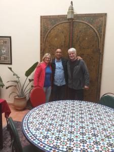 a group of three people standing next to a table at dar wassim el ghali in Rabat