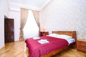 Postel nebo postele na pokoji v ubytování Cossacks Hostel