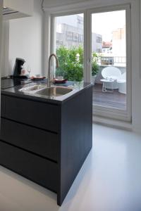 Kuchyň nebo kuchyňský kout v ubytování Leopold5 Luxe-Design Apartment