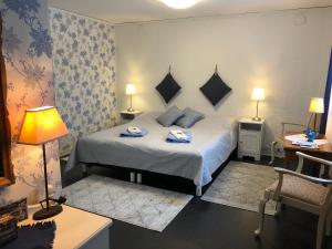 Säng eller sängar i ett rum på Stakaberg Konferens & Gårdshotell