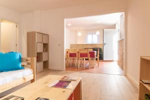 a living room with a couch and a table at La casa azul,una casa en la ciudad. in Logroño