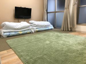 Postel nebo postele na pokoji v ubytování Hotel Mirai