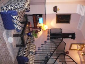 a spiral staircase in a room with a bed at Hotel Continental in Tangier