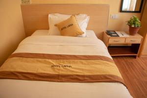Una cama o camas en una habitación de Hotel Lapha