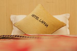 Una cama o camas en una habitación de Hotel Lapha