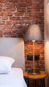 Un ou plusieurs lits dans un hébergement de l'établissement The Athens Version Luxury Suites