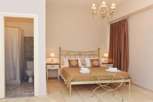 En eller flere senge i et værelse på Oisyra Hotel