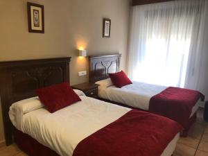 Postel nebo postele na pokoji v ubytování Hotel Patri