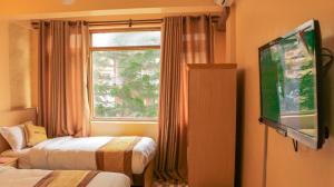 Una cama o camas en una habitación de Hotel Lapha