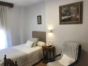 Postel nebo postele na pokoji v ubytování Hotel Patri