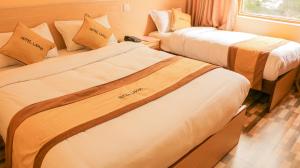 Una cama o camas en una habitación de Hotel Lapha
