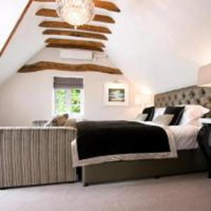 A bed or beds in a room at Karma Sanctum On The Green 