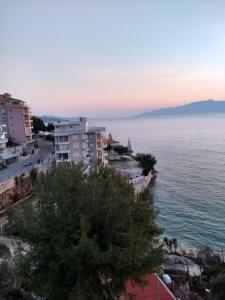 a view of the ocean from a building at Apartment in Sarande in Sarandë