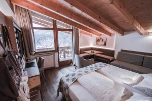 Posteľ alebo postele v izbe v ubytovaní Dolasilla Mountain Panoramic Wellness Hotel