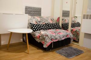 a room with a couch and a table with pillows at Rooms and Apartment Veral-KA in Karlovac