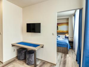 A bed or beds in a room at Hotel Familia