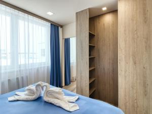 A bed or beds in a room at Hotel Familia
