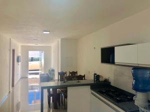 a kitchen with a sink and a counter top at Casa à 500 da Praia in Salinópolis