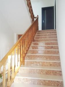 a staircase in a home with wooden stairs at Dream Apartments in Split