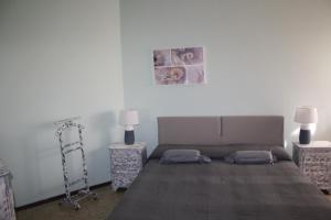 Postel nebo postele na pokoji v ubytování B&B Gloria Apartment