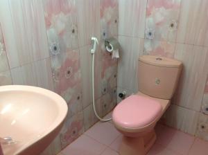 a bathroom with a pink toilet and a sink at Saman Homestay in Tangalle +160 photos