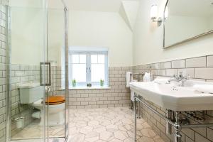 a bathroom with a sink and a toilet at Burnside Hotel in Stratford-upon-Avon