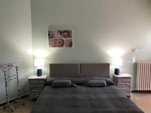 Postel nebo postele na pokoji v ubytování B&B Gloria Apartment