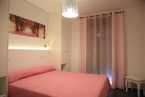Posteľ alebo postele v izbe v ubytovaní APARTAMENTOS LA VEREDA