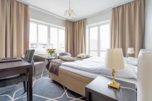 Voodi või voodid majutusasutuse Hotel Dania toas