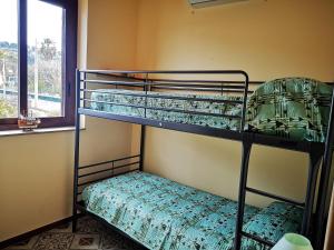 A bed or beds in a room at Casa di Poseidone