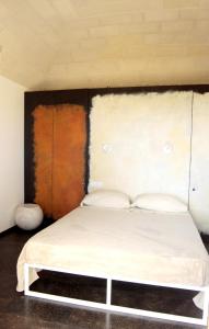 Postel nebo postele na pokoji v ubytování Cala Rossa Lodge