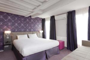 מיטה או מיטות בחדר ב-Hotel Massena