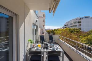 a balcony with a table and chairs on a balcony at VERASOL 3 in Albufeira