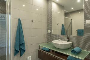 a bathroom with a sink and a mirror at VERASOL 3 in Albufeira +23 photos