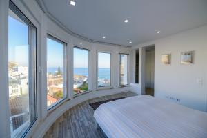 Ліжко або ліжка в номері Luz Beach Rooftop Penthouse