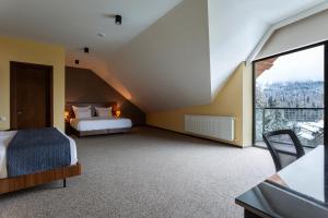 Voodi või voodid majutusasutuse AuRoom Bakuriani Resort toas