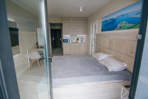 Säng eller sängar i ett rum på Swiss Quality Apartments (Beach Tower)