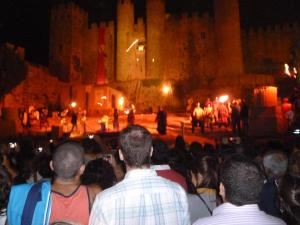 a crowd of people standing in front of a castle at Good vibes in Amoreira