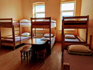 Postel nebo postele na pokoji v ubytování Krone Hostel