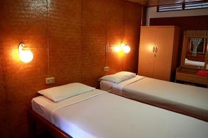Postel nebo postele na pokoji v ubytování Ben Guesthouse