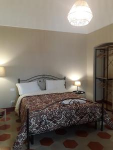 Ein Bett oder Betten in einem Zimmer der Unterkunft Dimora Don Francesco