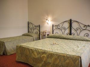 Voodi või voodid majutusasutuse Hotel Garnì Bartabel toas
