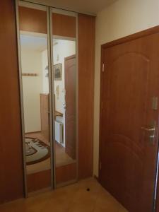 a room with a closet and a glass door at Grunwaldzka 7 Pobierowo in Pobierowo