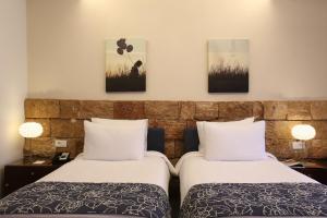 Letto o letti in una camera di Monoberge Hotel
