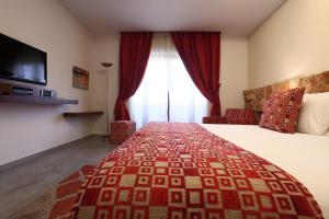 Letto o letti in una camera di Monoberge Hotel