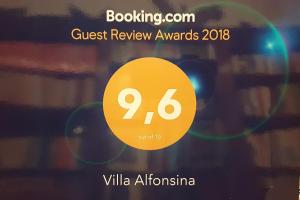 a sign that reads guest review awards with a yellow number at Villa Alfonsina in Mexico City